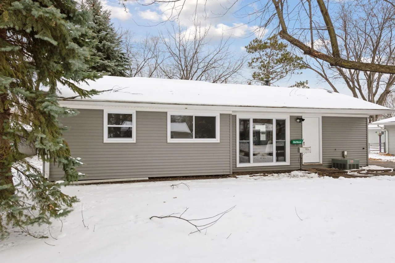 Rebuilt single-storey ranch exterior with new siding